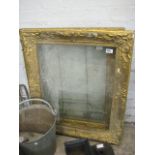Pair of decorative gilt frames with glass