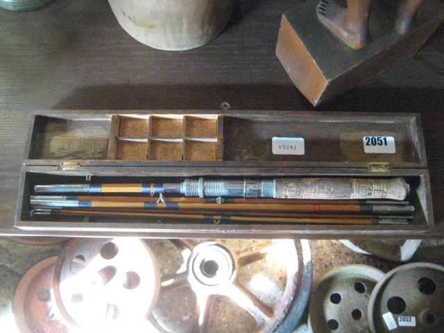 Split cane fly fishing rod cotnained within a wooden case