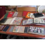 Table top of various stamp albums