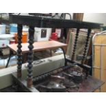 Black painted occasional table with turned supports and cross stretcher