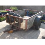 Small high sided single axle trailer with 2 spare wheels
