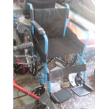 Blue self propelled wheelchair with footrests