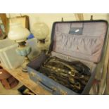 Case and box containing brassware incl. kettle, horse brasses and swingers together with 2 oil lamps