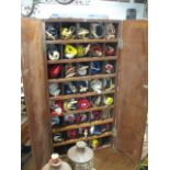 Fitted wooden cabinet containing large quantity of maritime signal flags