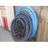 Various blue and black drainage pipes