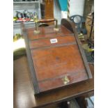 Mahogany coal scuttle with brass shovel