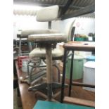 3 Adjustable machinists stools and 1 wooden laboratory stool