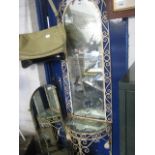 Free standing wrought metal hall stand with mirrored back and surface together with a spare bevelled