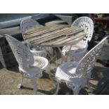 Small metal garden table with wooden top and 4 chairs