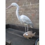 Heron and fish garden ornament