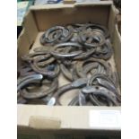 Tray of metal horseshoes