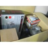 Box containing a variety of items to include dish rack, rat bait, blanket, outdoor light, etc