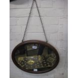 Mahogany framed oval wall mirror