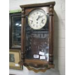 Oak cased wall clock with pendulum and key