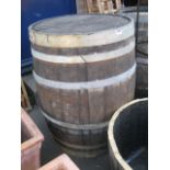 Large wooden and metal banded wine barrel