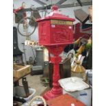 Red painted metal post box