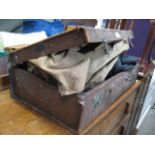 Vintage suitcase containing vintage clothing