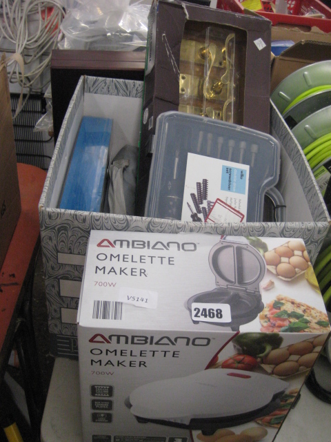 Omelette maker and a crate of various tools