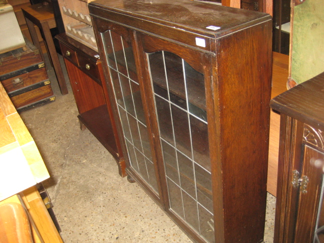 Dark oak glazed display cabinet with leaded glass