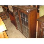 Dark oak glazed display cabinet with leaded glass