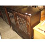 Dark oak glazed display cabinet with leaded glass