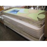 White metal framed single bed with 2 mattresses