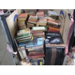 Stillage containing paperback and hardback books (stillage not including)