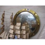 Circular brass framed wall mirror