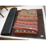 Brown doormat and Peruvian style rug