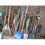 Large quantity of outdoor tools incl. spade, fork, pickaxe, rakes, etc.