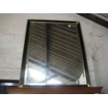 Black and gilt framed and bevelled rectangular wall mirror (detached gilt leaf present)