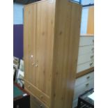 Pine effect wardrobe with 3 drawers to base