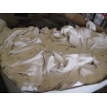 Shallow pallet of mixed white and brown towels