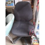 Black upholstered swivel office chair