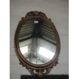 Oval gilt framed wall mirror