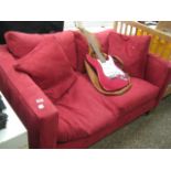 Red upholstered 2 seater sofa