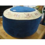 Blue and floral upholstered pouffe