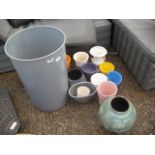Plastic waste bin and quantity of ceramic plant pots