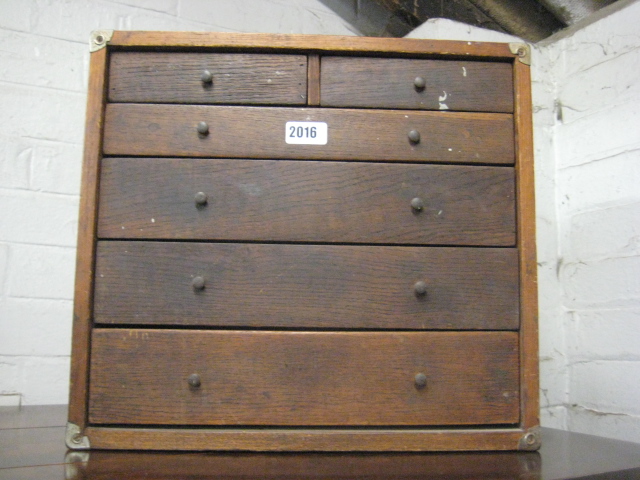 Small oak multi drawer tool cabinet with contents of various files, drill bits and other tools