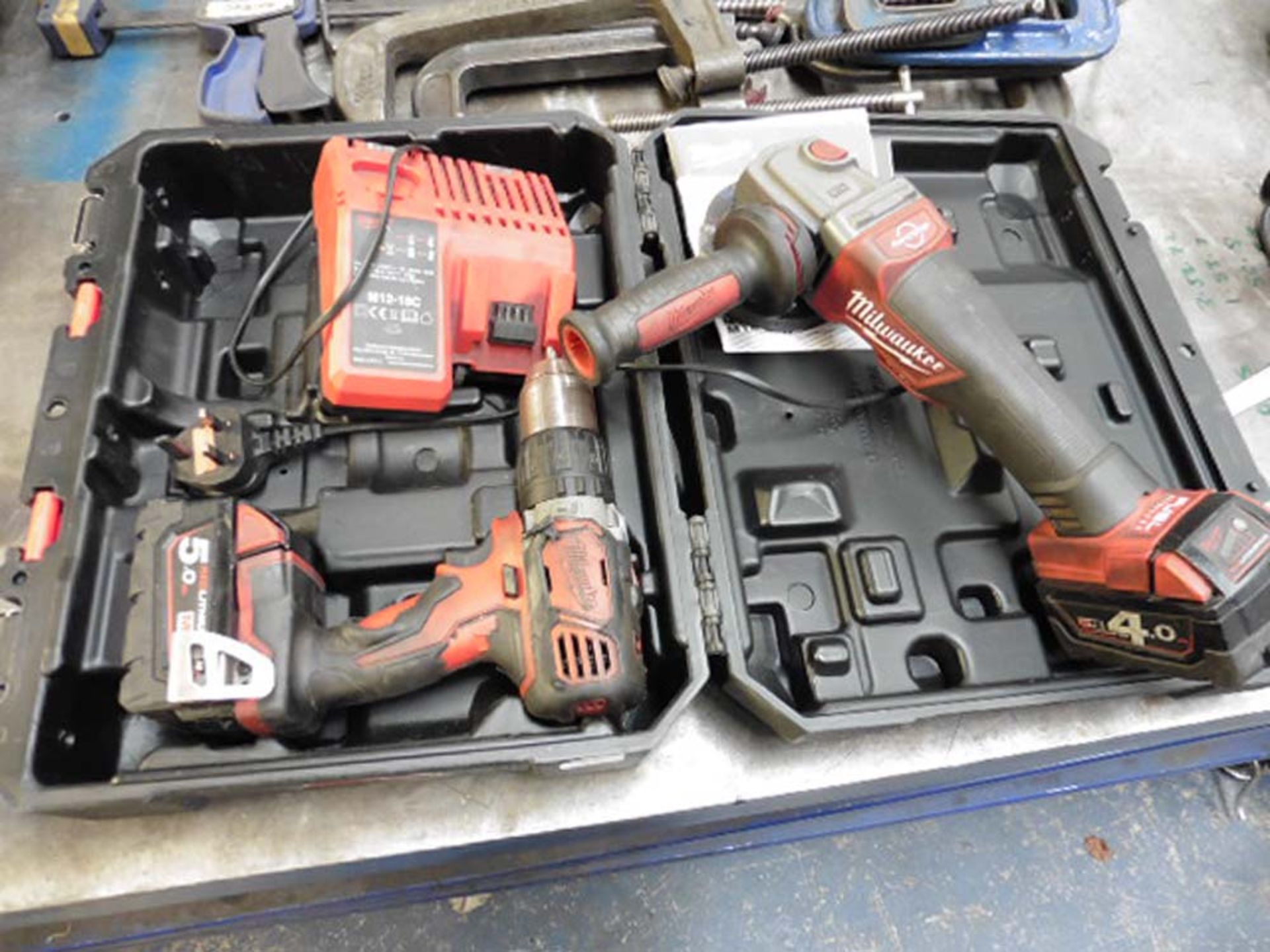 Milwaukee Red Lithium cordless drill and mini grinder with charger