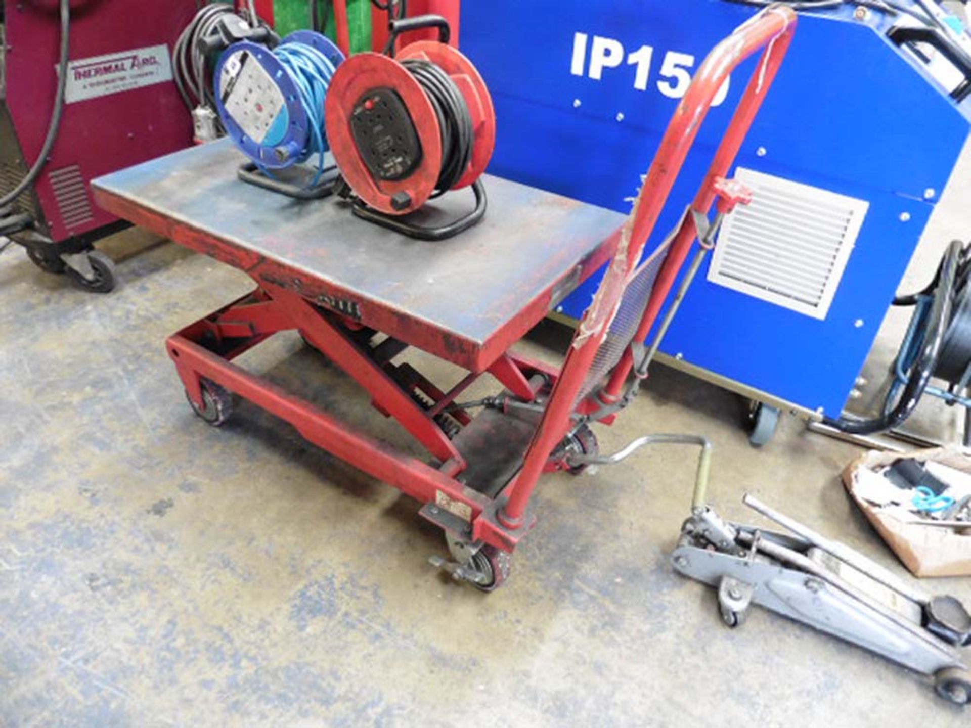 Red platform Scissor lift trolley with treadle