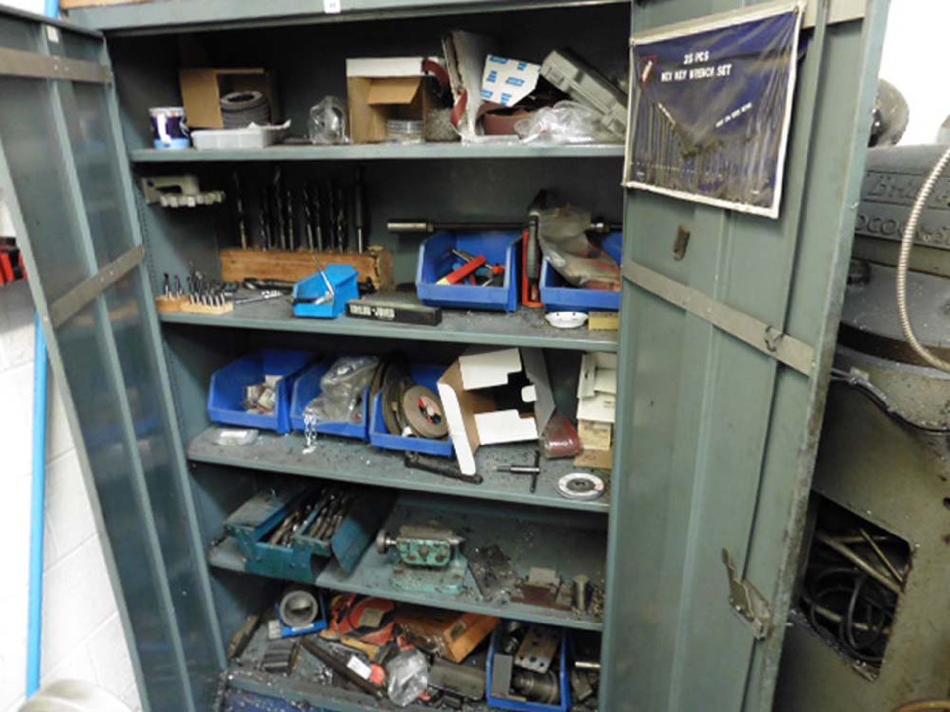 Grey Steel double door cabinet and contents of assorted drills, tooling and consumables