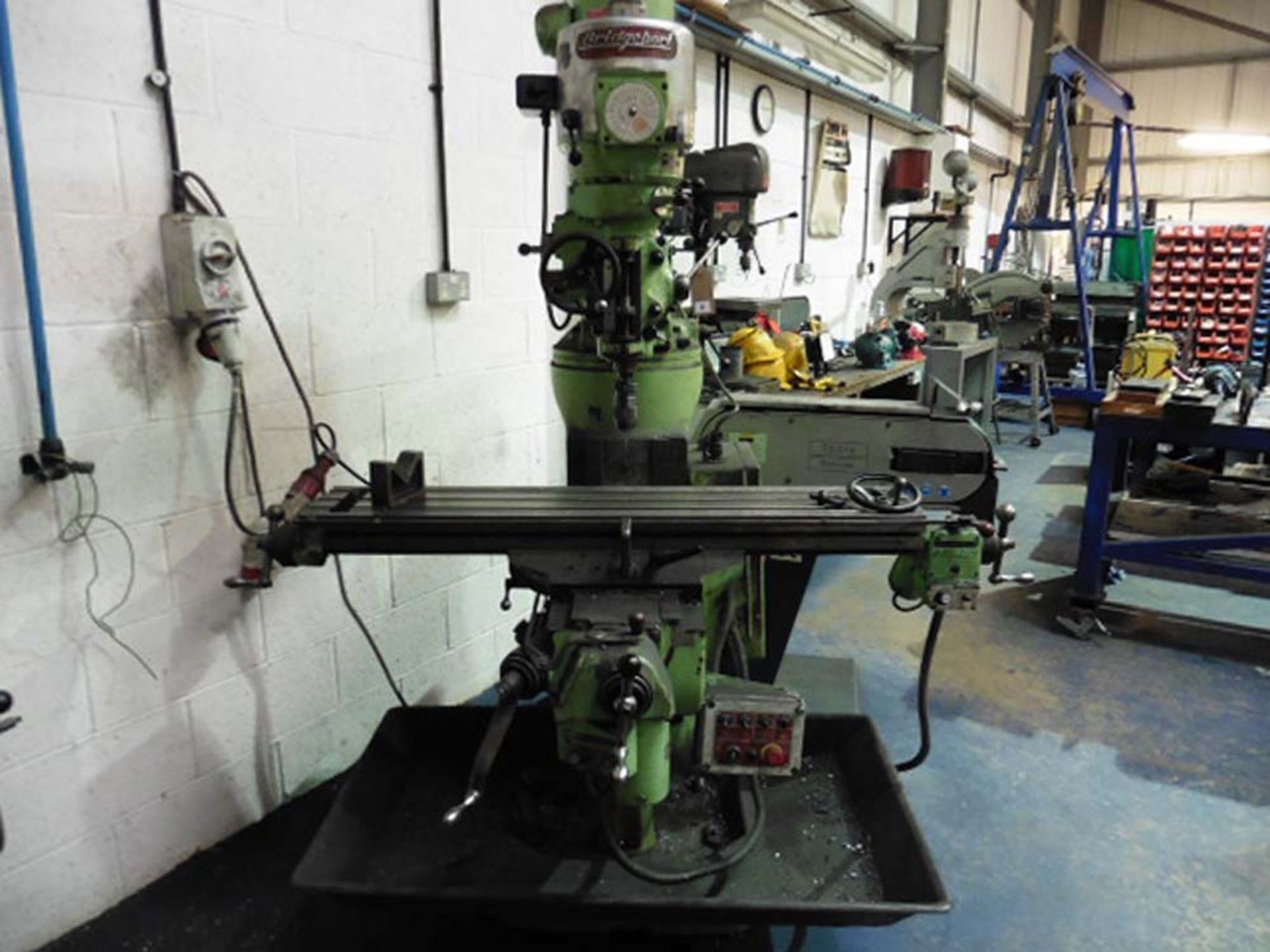 Bridgeport Turret Milling Machine with a powered Table size 9'' x 48'' Serial number 243951176LX