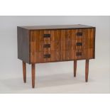 A 1960's Danish rosewood chest of six small drawers, each with turned integral handles,