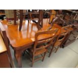 Large dining room extending table with block wood finish top and 4 matching rush seated chairs