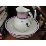 A lilac and white glazed jug and bowl set