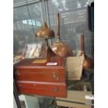 Two boxes containing scales, plus copper funnels and two hydrometer tables