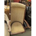 Beige upholstered sling back easy chair on wooden frame