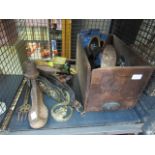 A cage containing a quantity of horse brasses, vintage tins, thread, toasting forks, shoe lasts