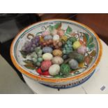 Floral decorated platter plus a grapevine patterned bowl and stone eggs and grapes